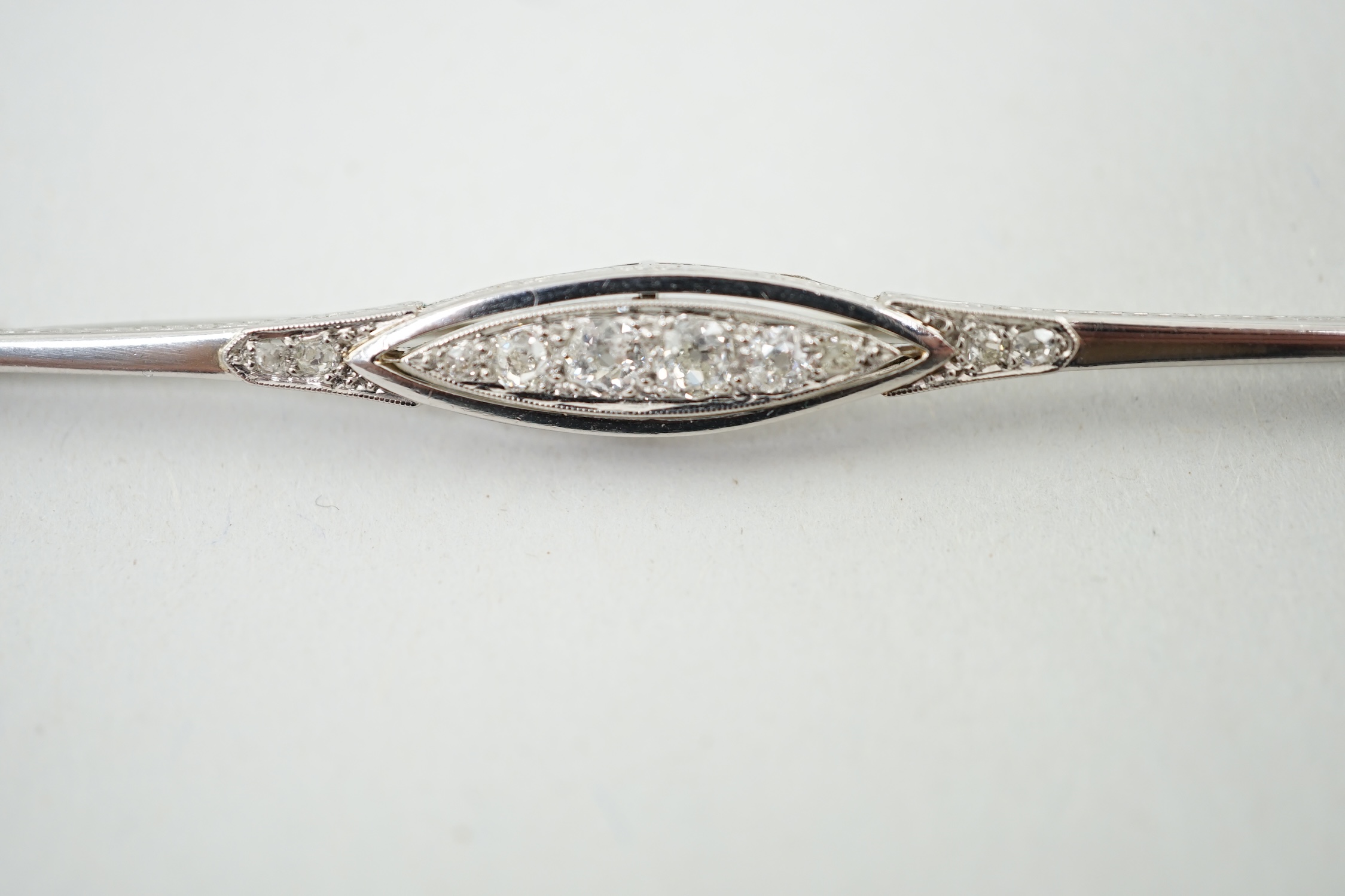 An early 20th century platinum? and diamond cluster set bar brooch